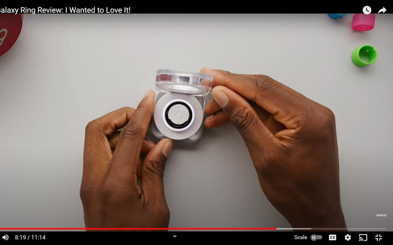 Before scaling, the paused YouTube video has black bars above and below the picture.